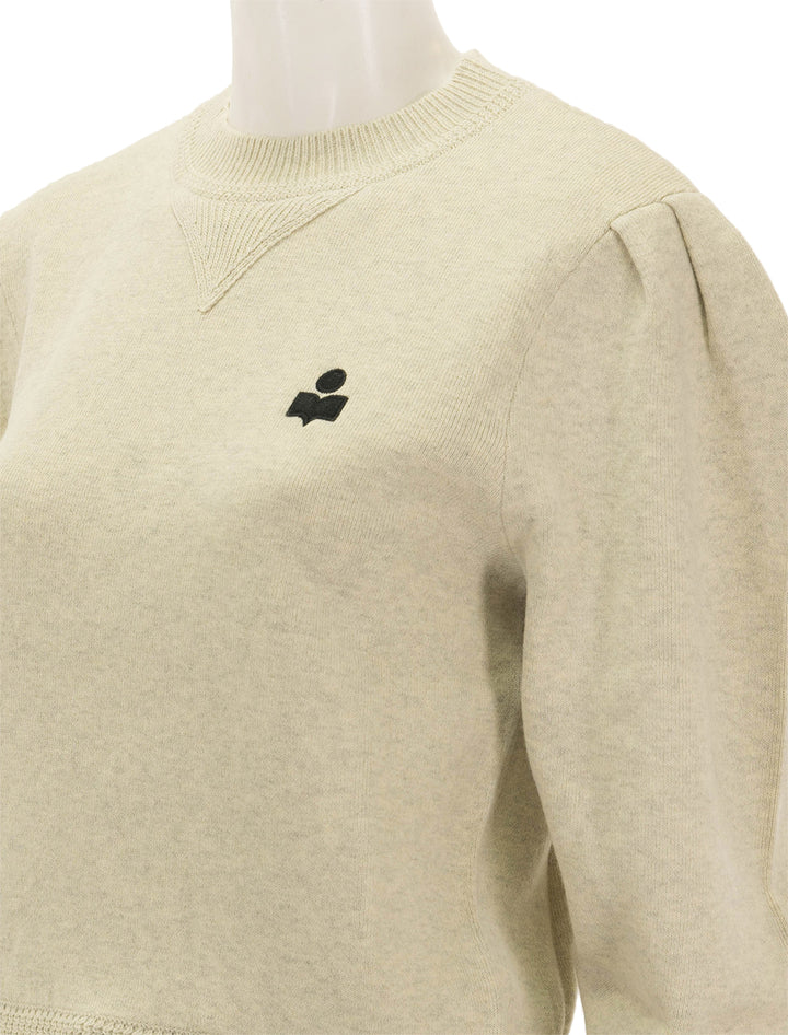 Close-up view of Isabel Marant Etoile's kelaya pullover in light grey.