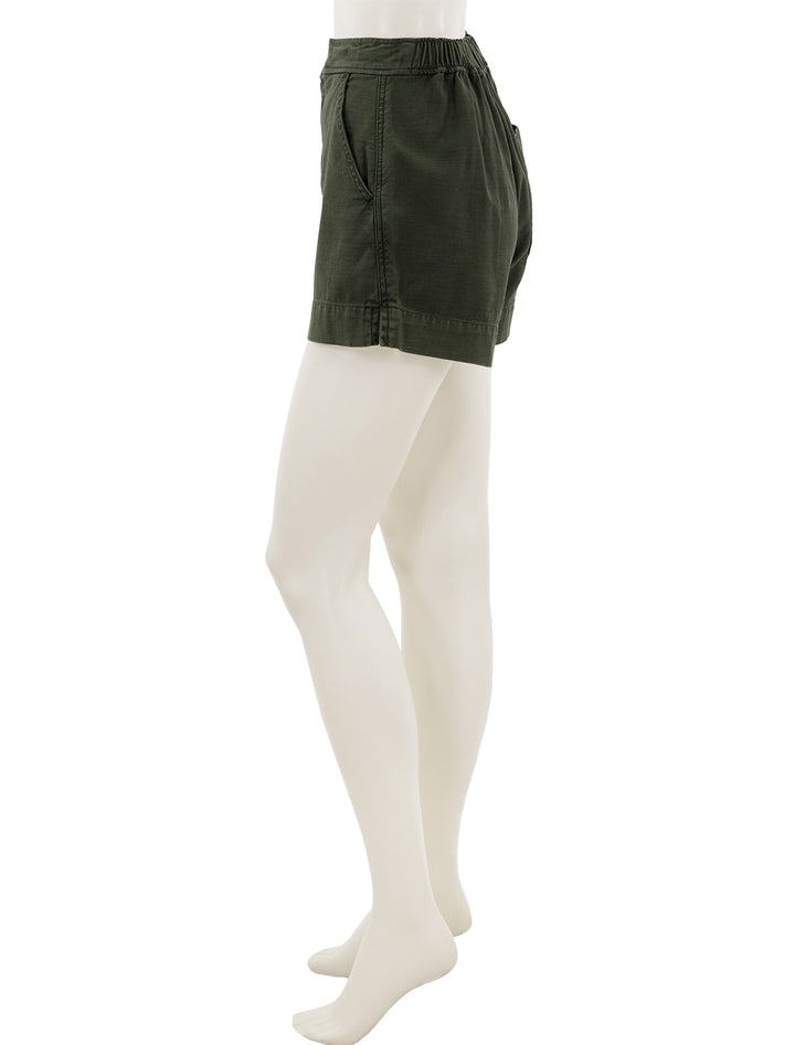 Side view of Alex Mill's alessandra pull-on shorts in pine needle.