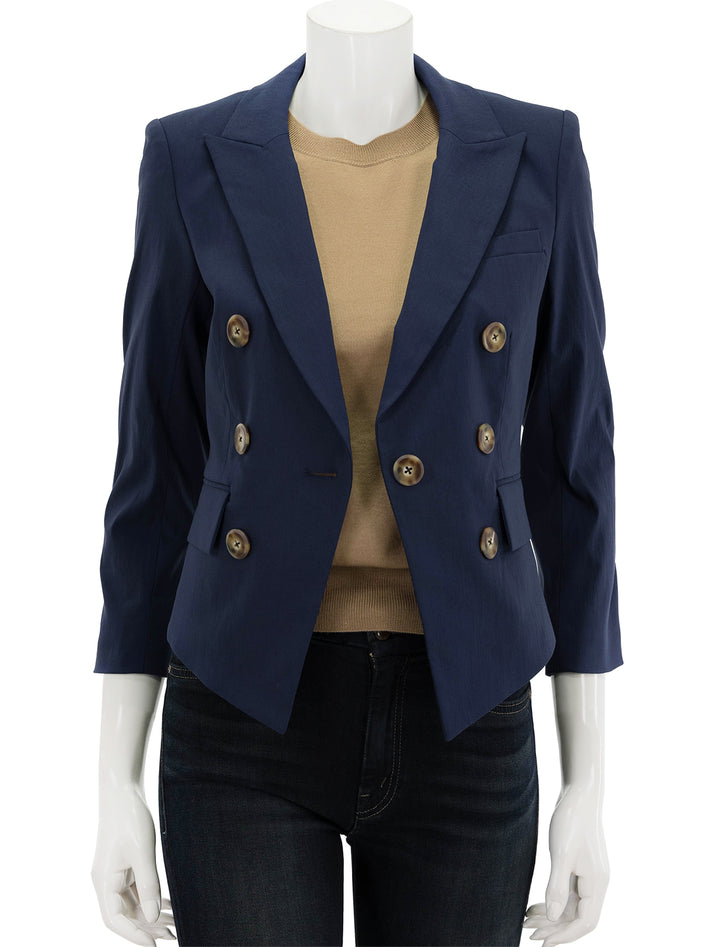 Front view of Veronica Beard's lutece dickey jacket in marine, unbuttoned.