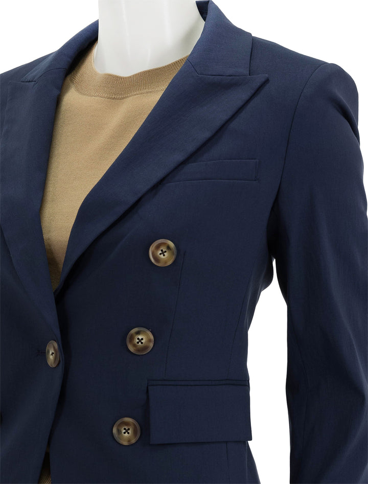 Close-up view of Veronica Beard's lutece dickey jacket in marine.