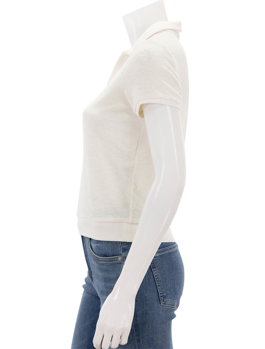 Side view of Marine Layer's vintage polo in antique white.