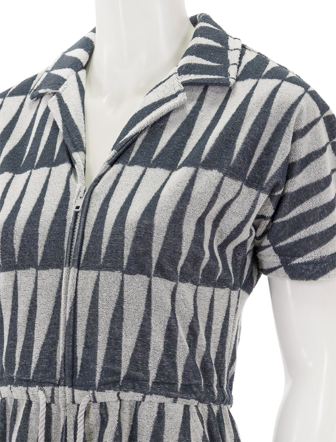 Close-up view of Marine Layer's terry out romper in black and white geo triangle.