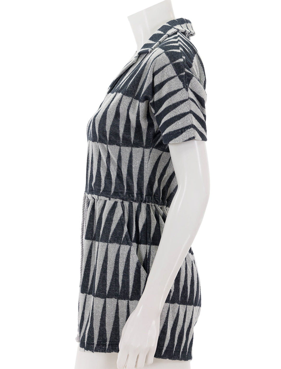 Side view of Marine Layer's terry out romper in black and white geo triangle.