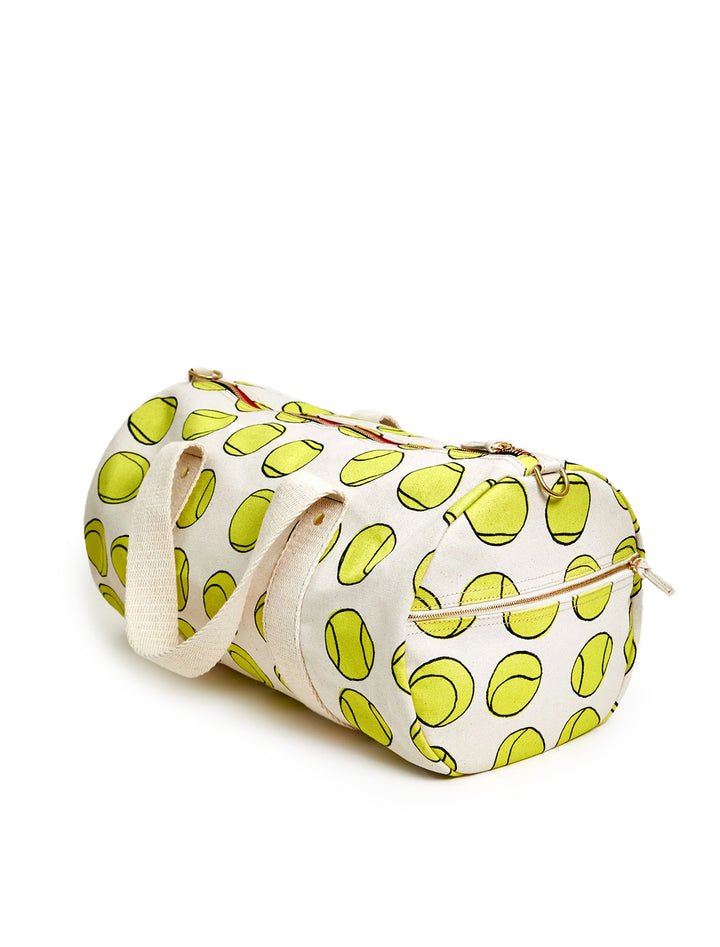 Side angle view of Clare V.'s tennis balls duffle bag.