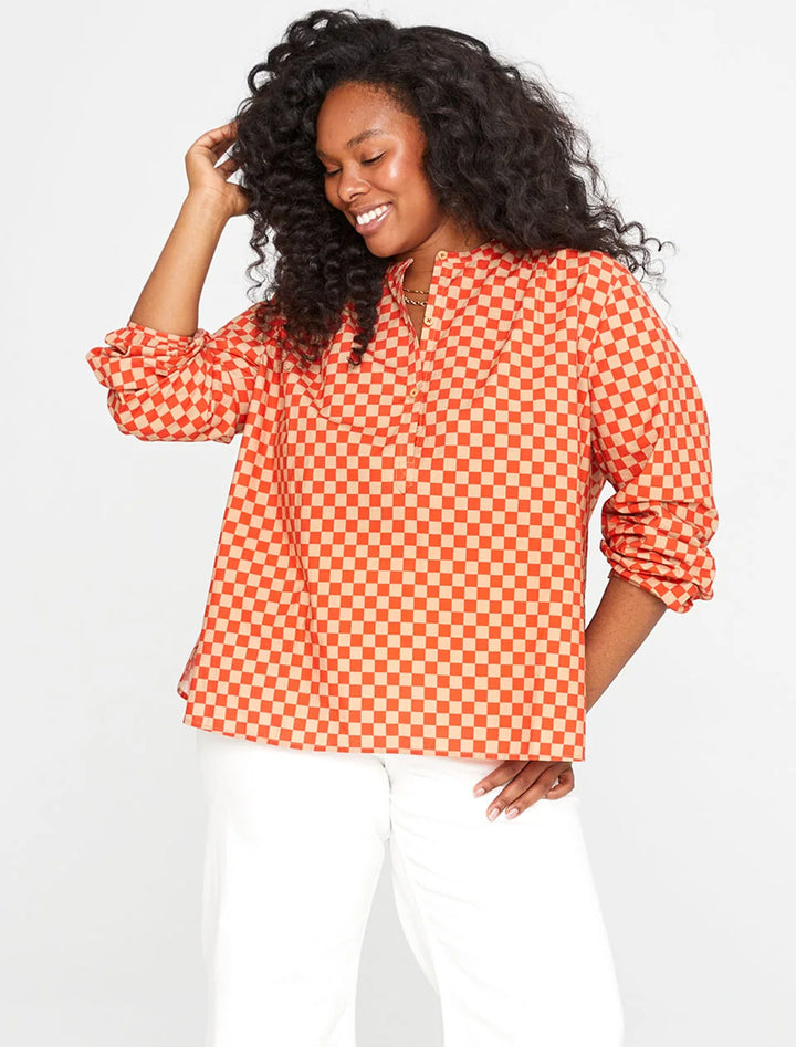 Model wearing Clare V.'s st. martin top in poppy and khaki checker.