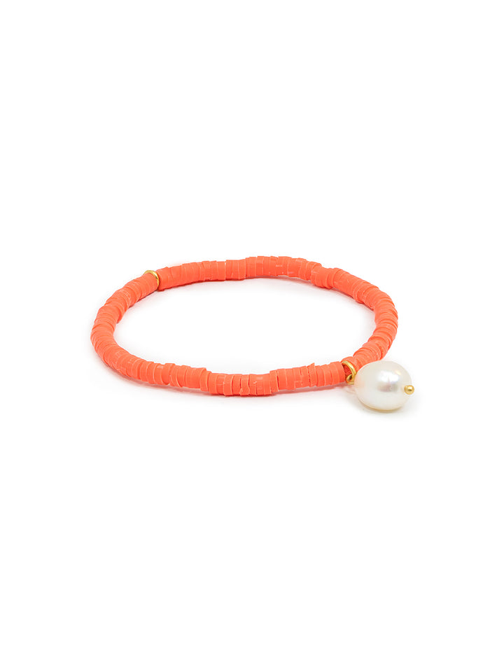 Front view of Clare V.'s beaded disc stretch bracelet with coral and pearl.