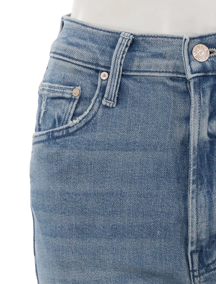 Close-up view of Mother Denim's high waisted rider ankle in fish out of water.