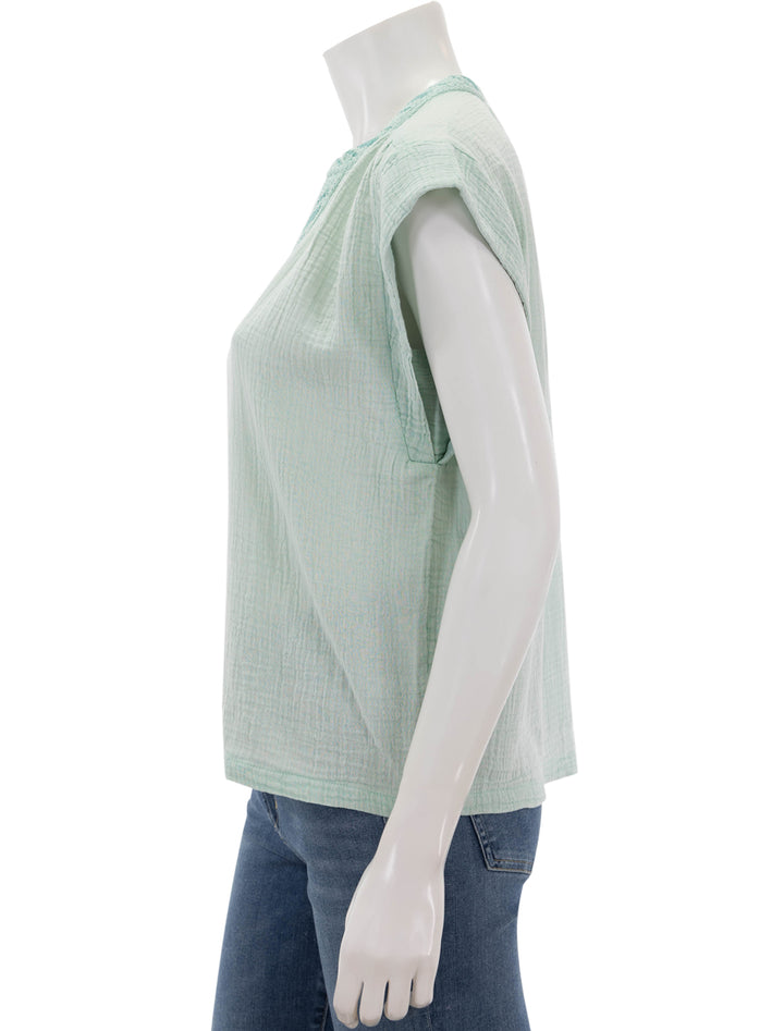 Side view of Faherty's lucia top in surf spray.
