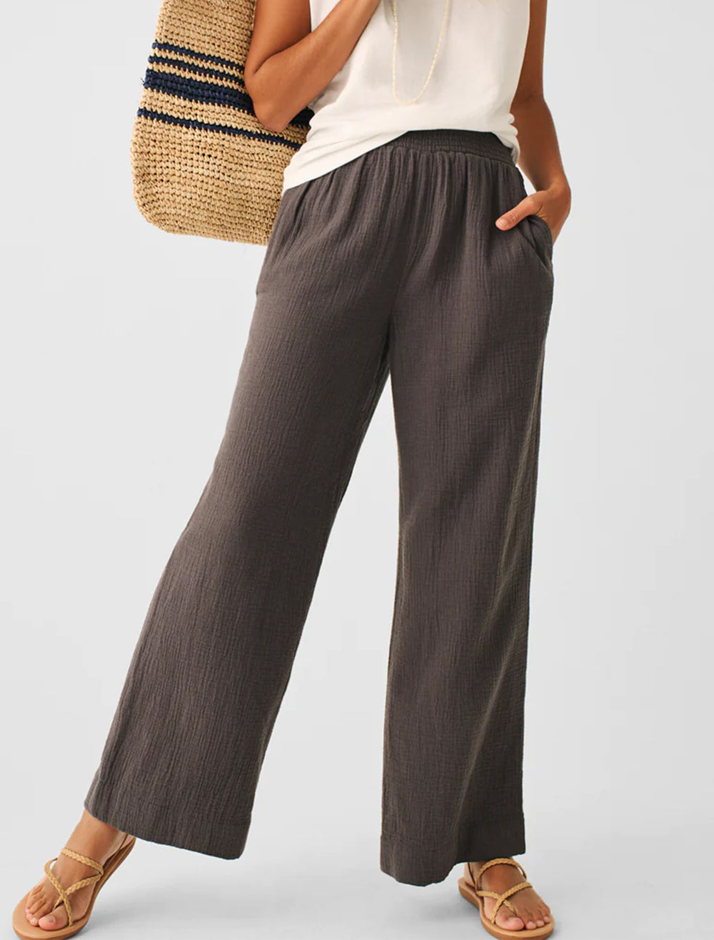 Model wearing Faherty's wide leg gauze pant in washed black.