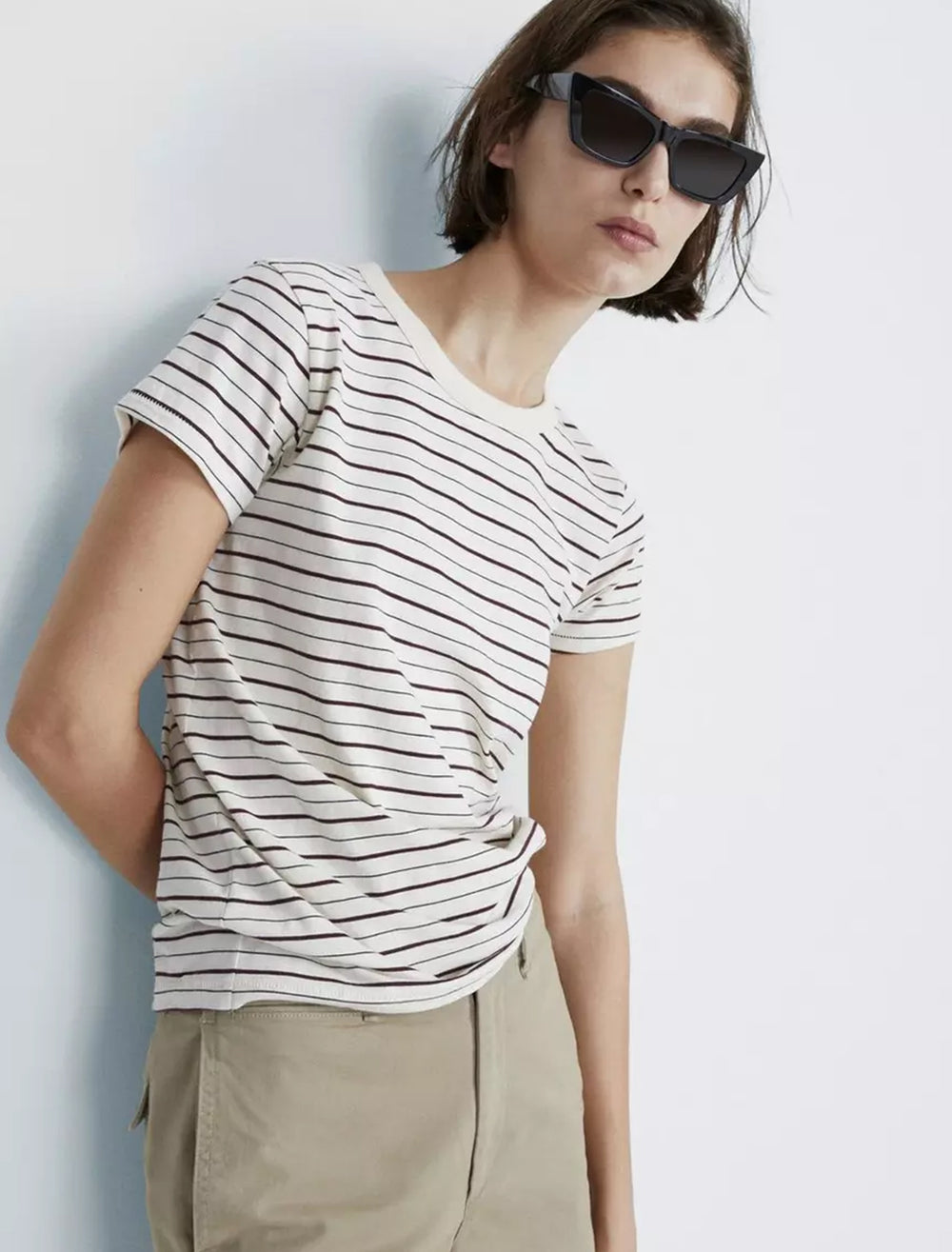 Model wearing Rag & Bone's the slub stripe tee in white and mahogany.