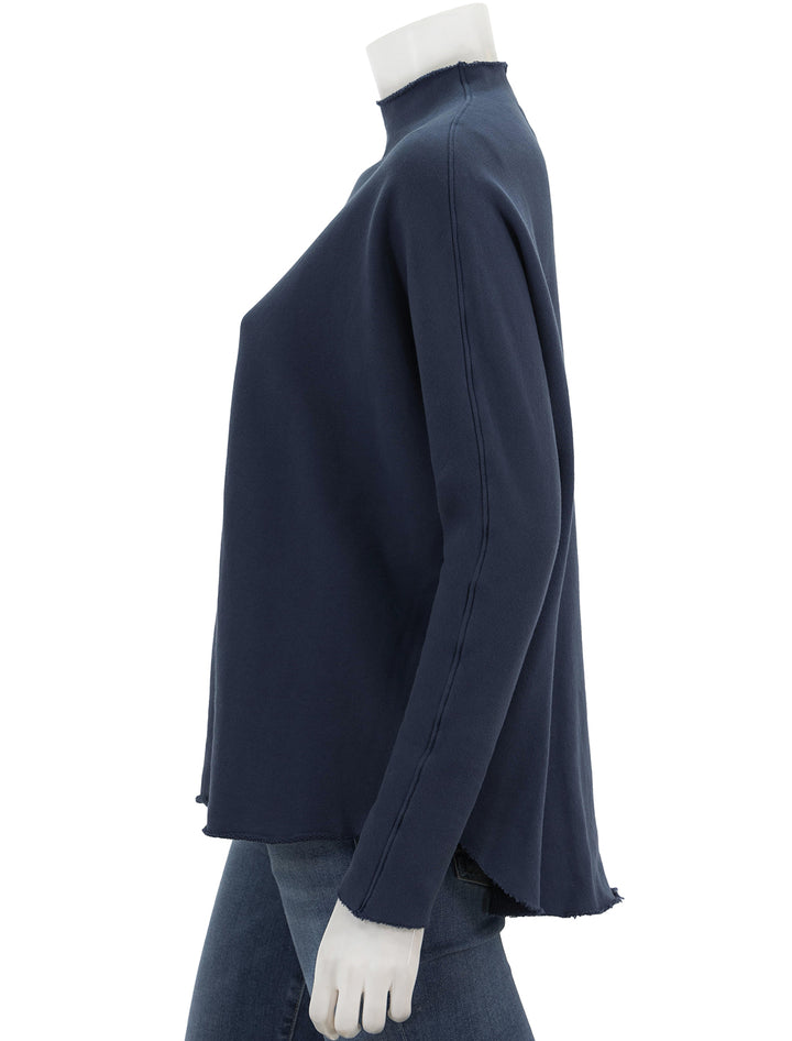 Side view of Frank & Eileen's effie long sleeve funnel neck capelet in atlantic.