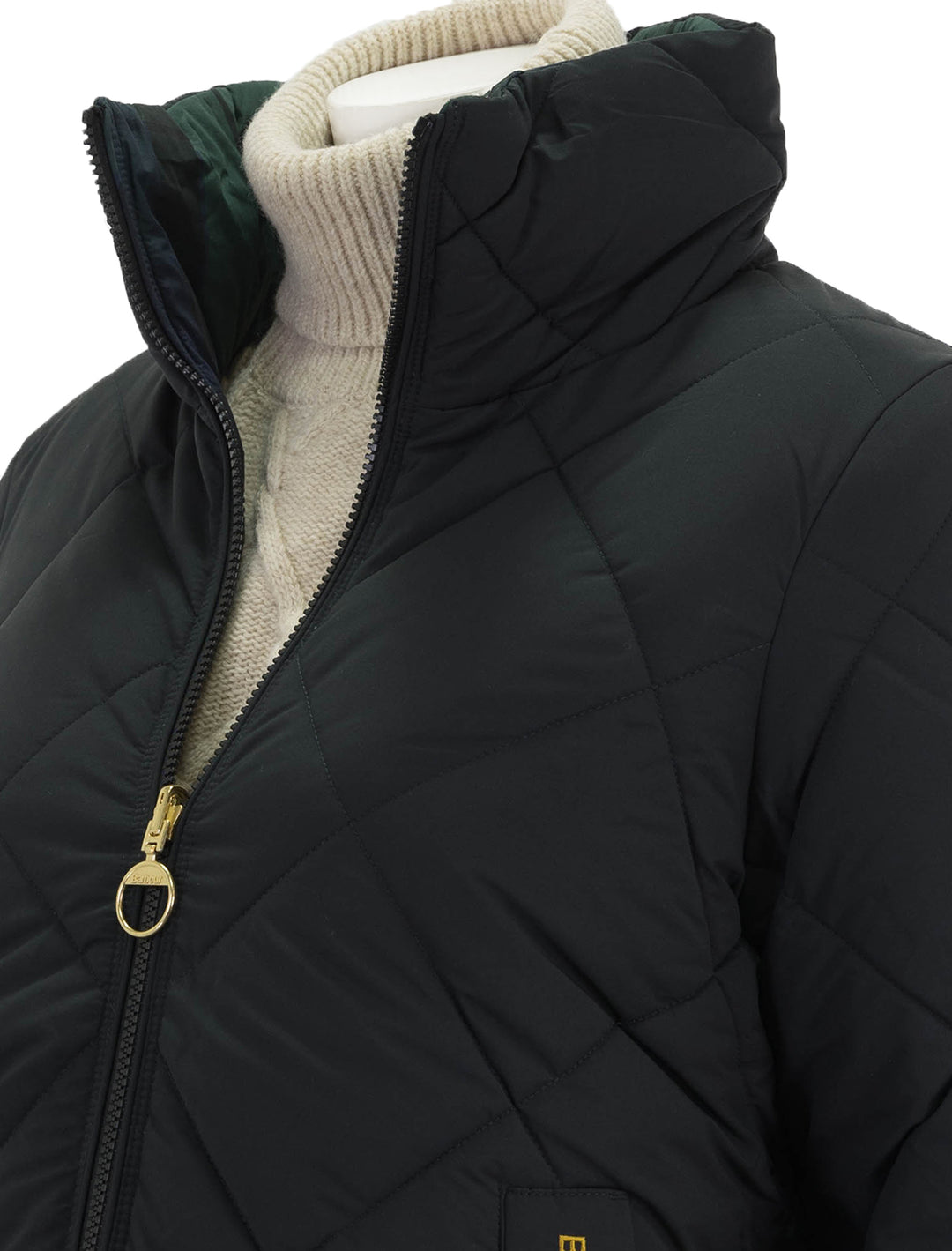 Close-up view of Barbour's reversible hudswell quilt jacket in black.