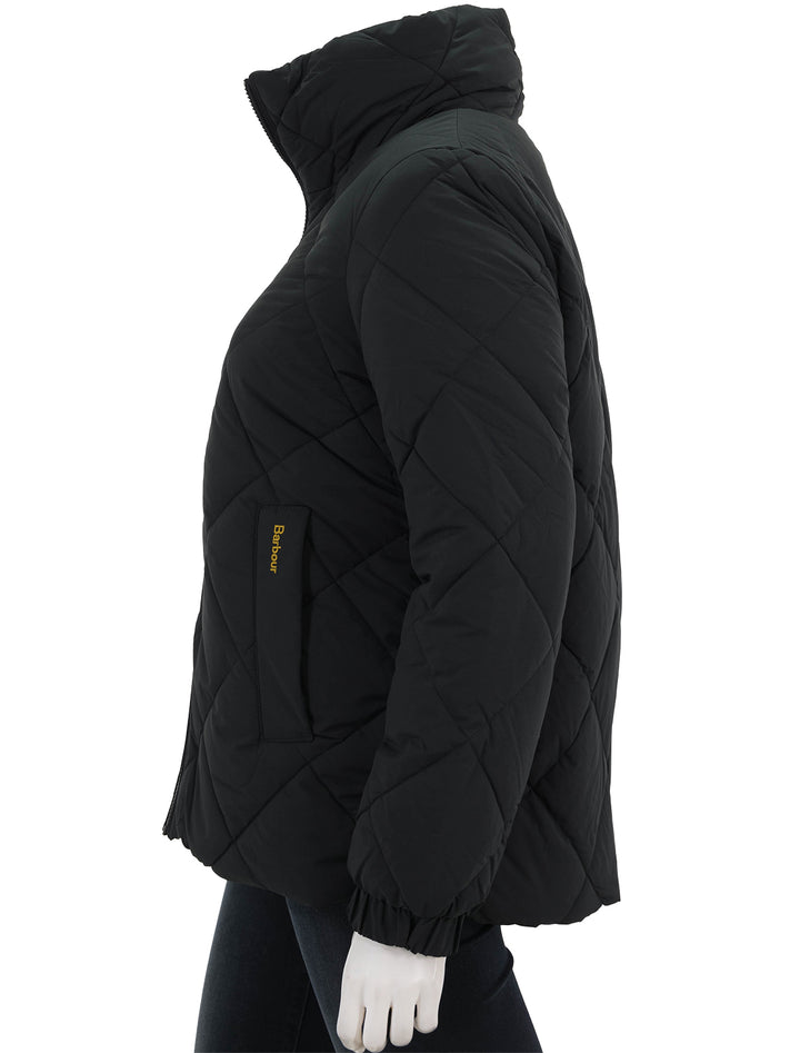 Side view of Barbour's reversible hudswell quilt jacket in black.