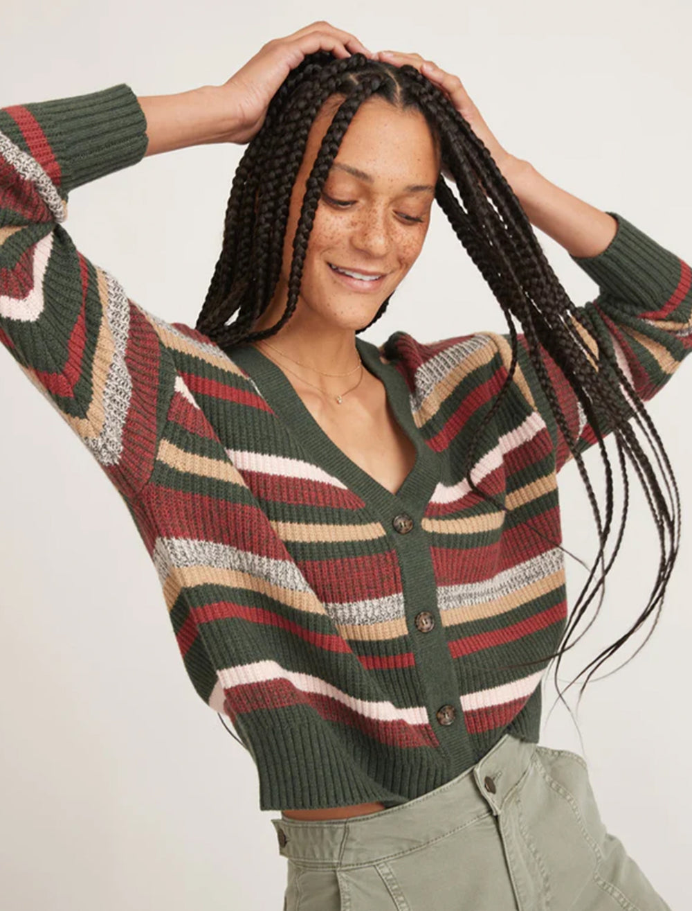 Model wearing Marine Layer's robin striped crop cardigan.