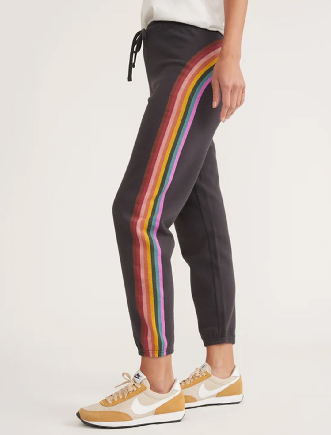 Model wearing Marine Layer's anytime sweatpant in washed black.
