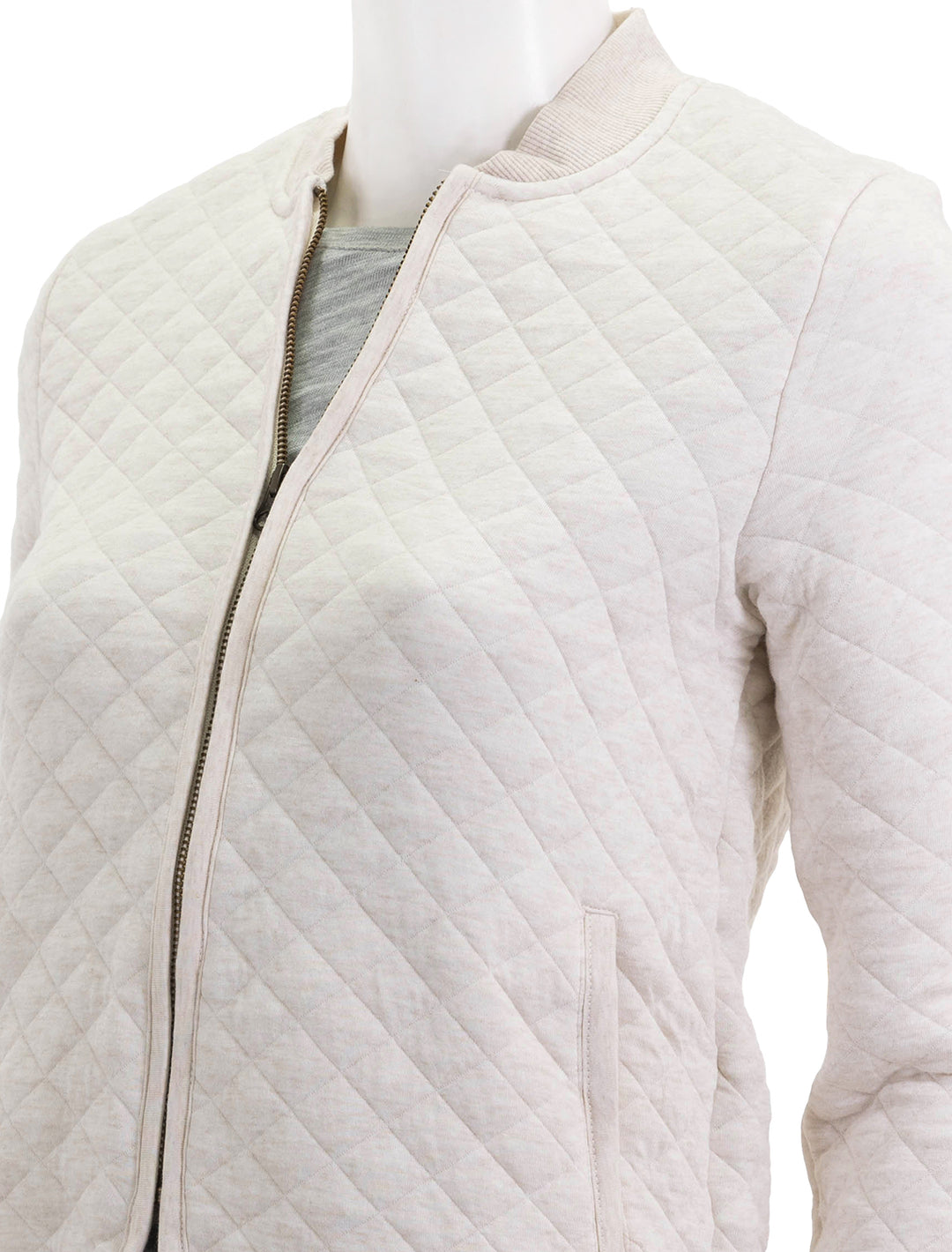 Close-up view of Marine Layer's corbet quilted bomber in oatmeal.