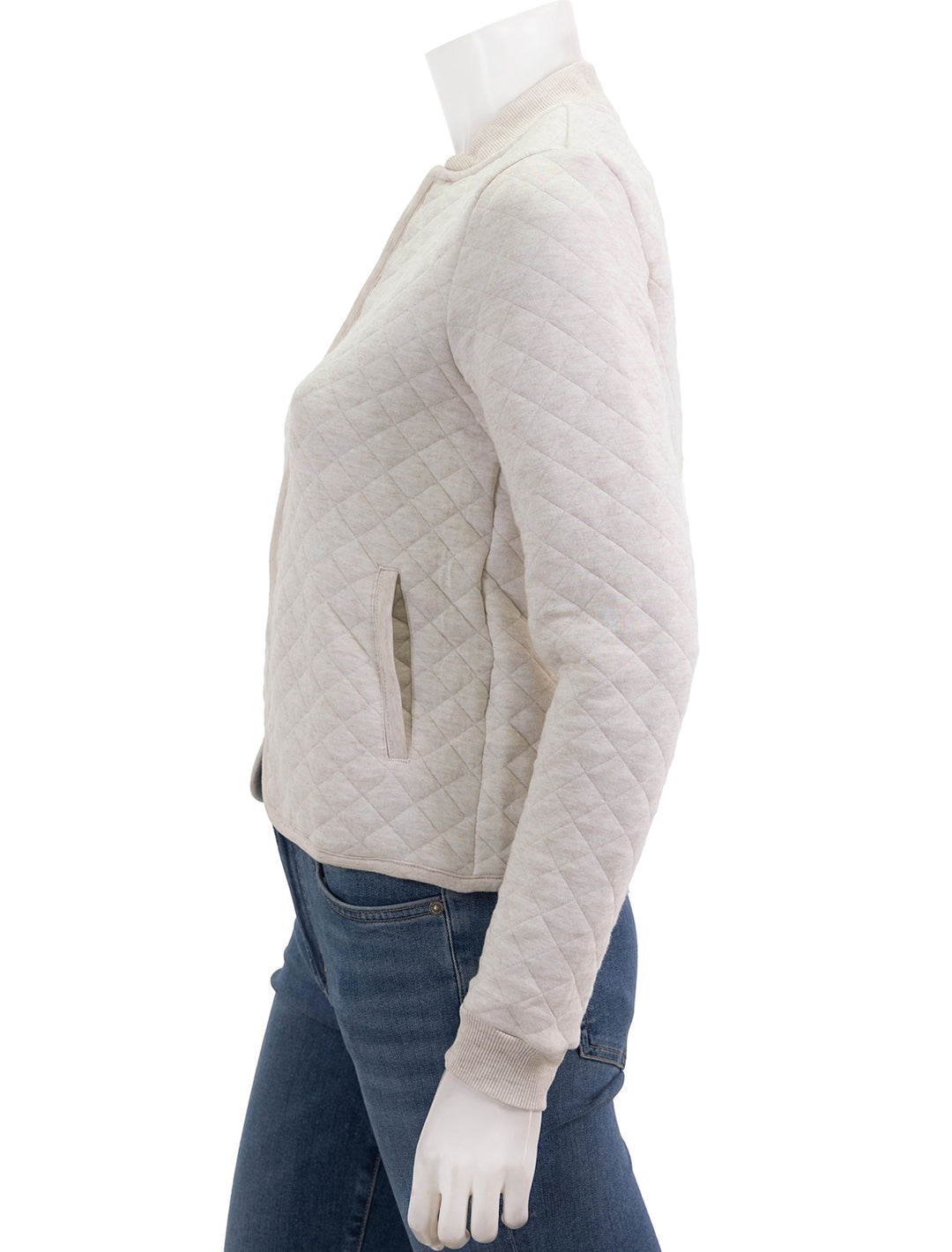 Side view of Marine Layer's corbet quilted bomber in oatmeal.