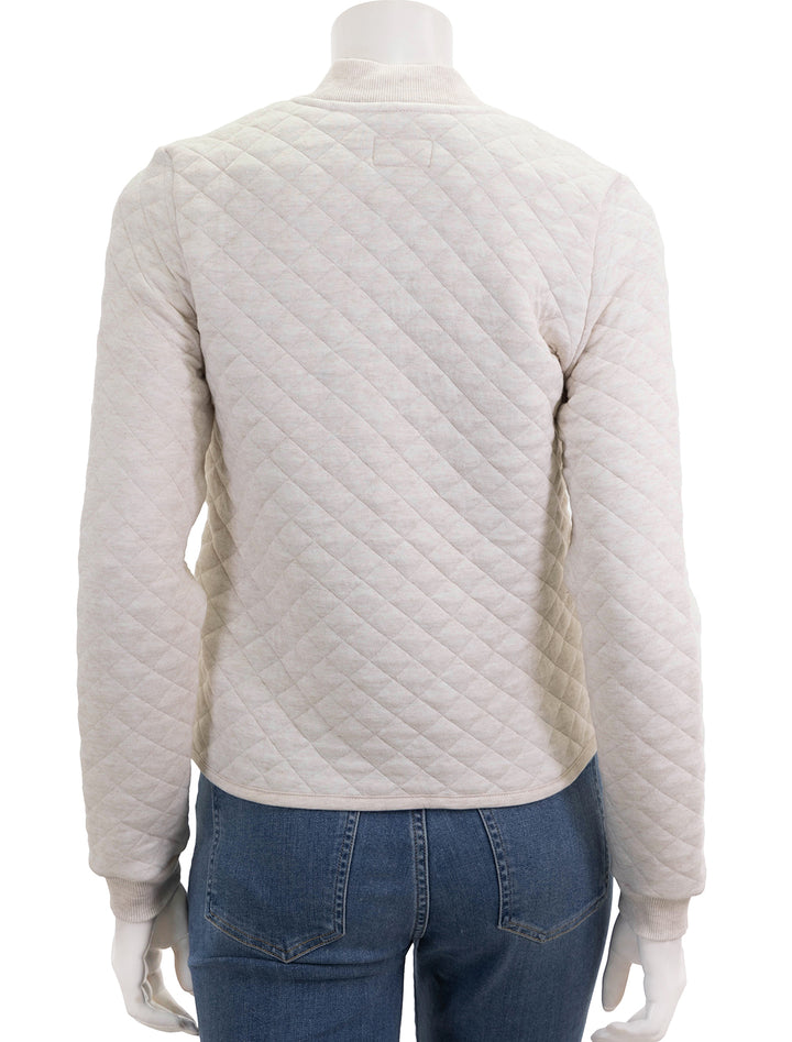 Back view of Marine Layer's corbet quilted bomber in oatmeal.