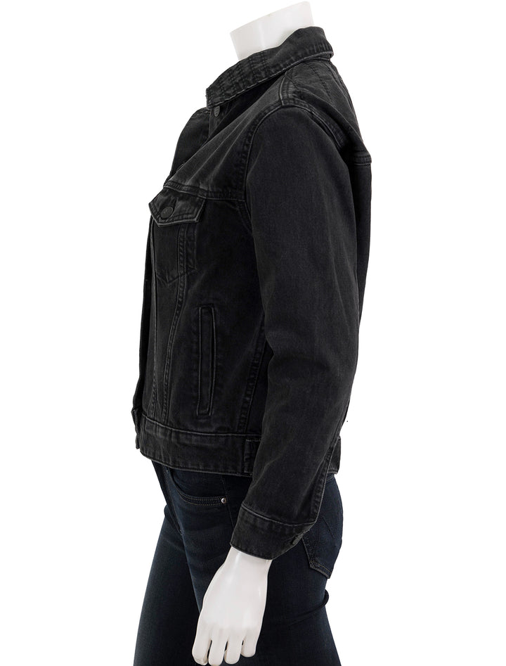 Side view of Marine Layer's oversized denim jacket in washed black.