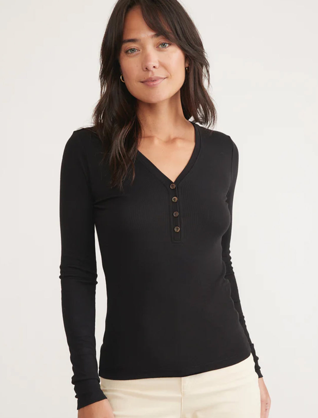 Model wearing Marine Layer's lexi rib henley in black.