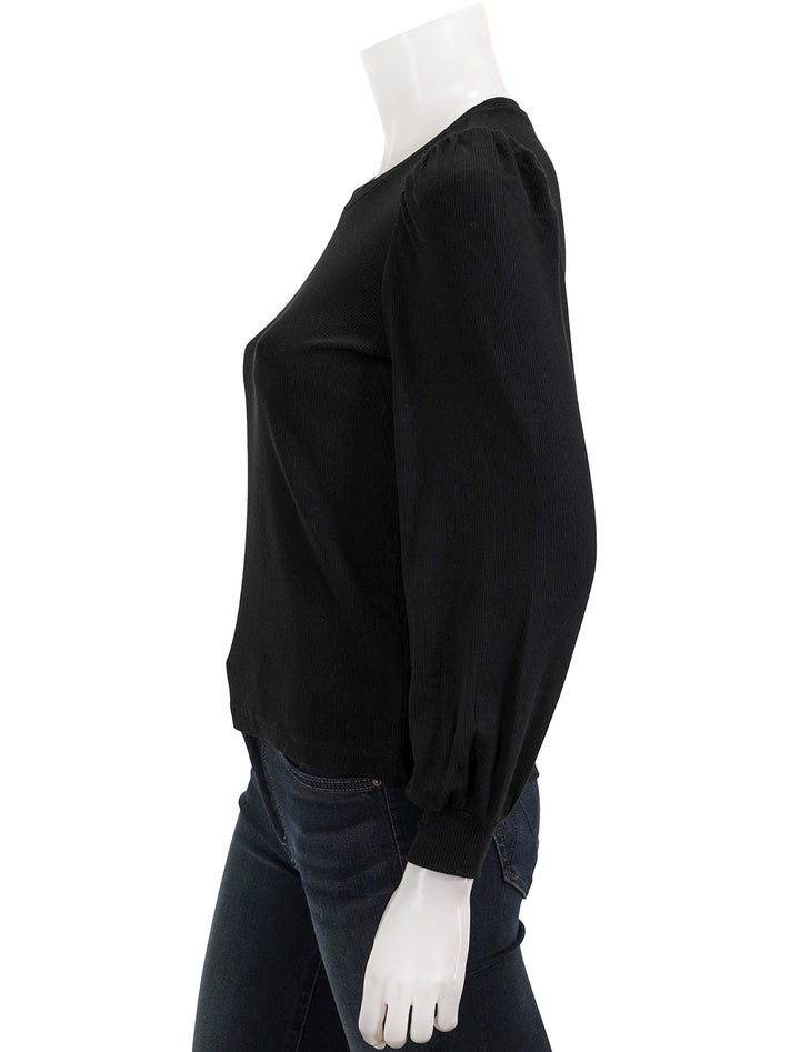 Side view of marine layer's lexi puff sleeve top in black.