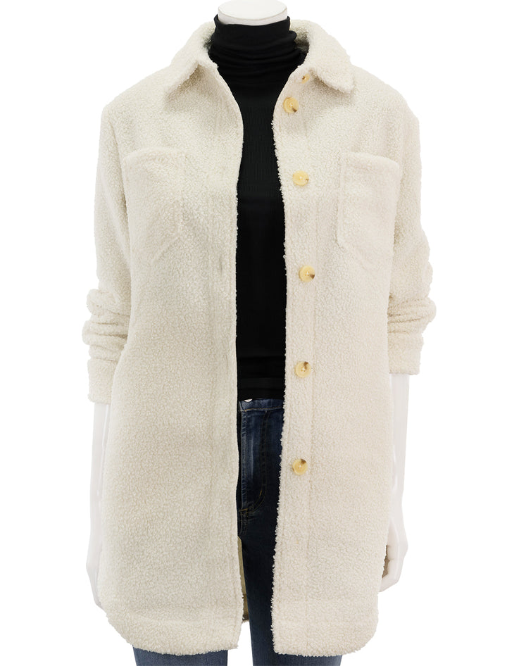 Front view of Marine Layer's sherpa bailey shirt jacket in ivory, unbuttoned.