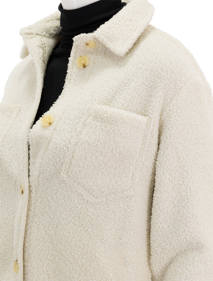 Close-up view of Marine Layer's sherpa bailey shirt jacket in ivory