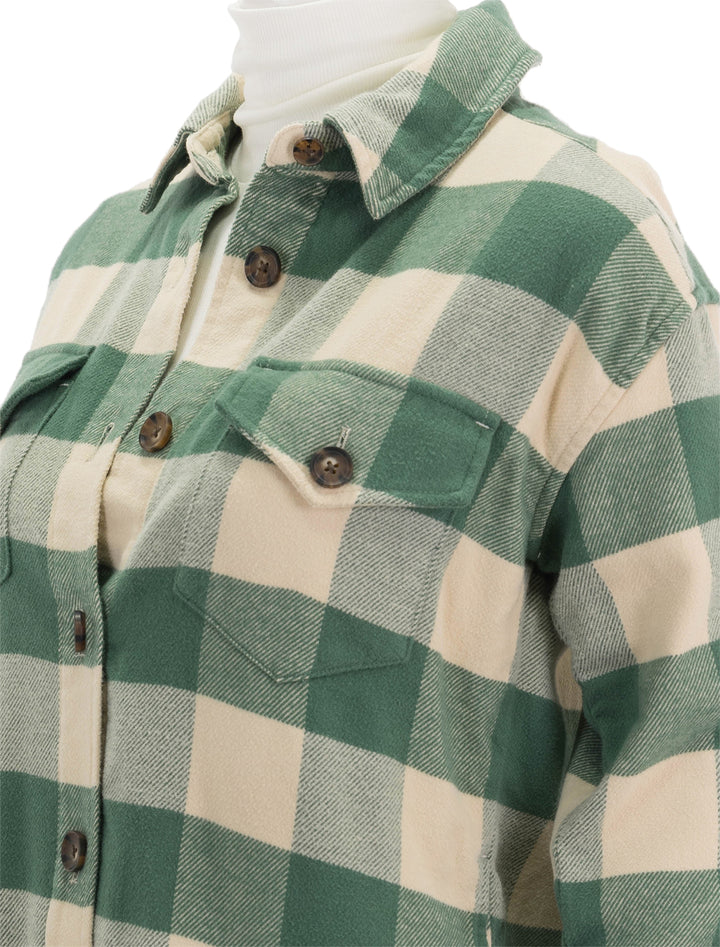 Close-up view of Marine Layer's bailey shirt jacket in green buffalo check.