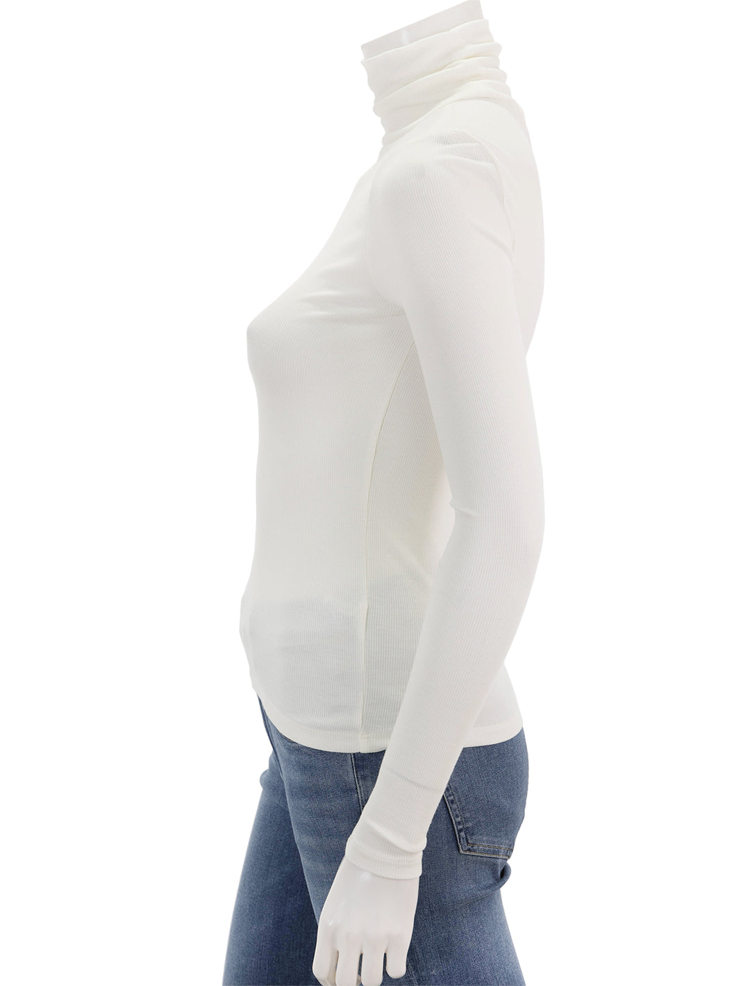 Side view of Marine Layer's lexi rib turtleneck in antique white.
