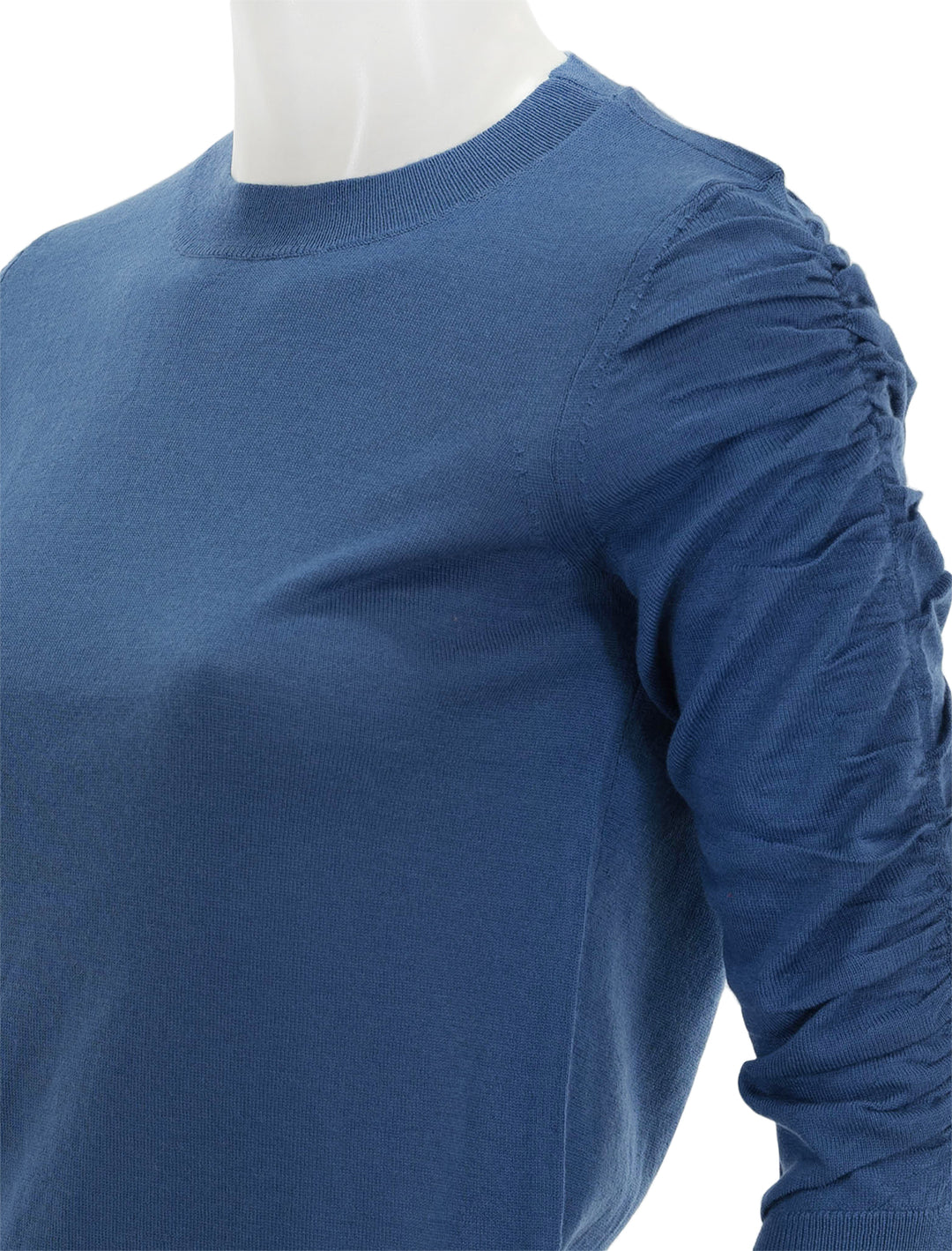 Close-up view of Veronica Beard's kase pullover in dark blue.