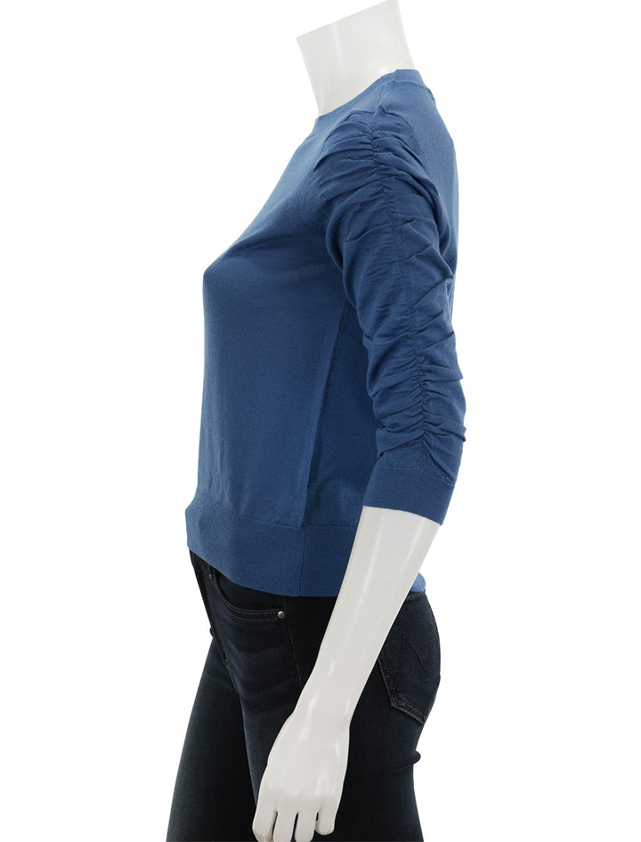 Side view of Veronica Beard's kase pullover in dark blue.
