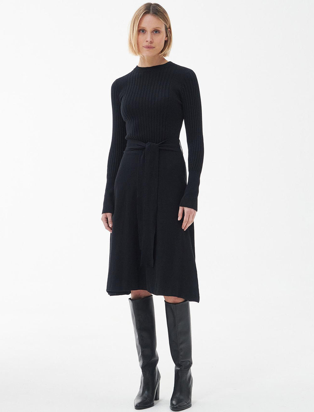 Model wearing Barbour's amal midi knit dress in black.