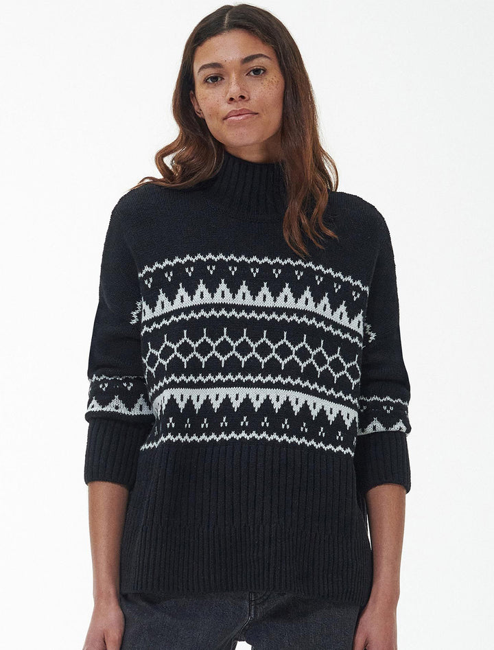 Model wearing Barbour's pine knit turtleneck in black.