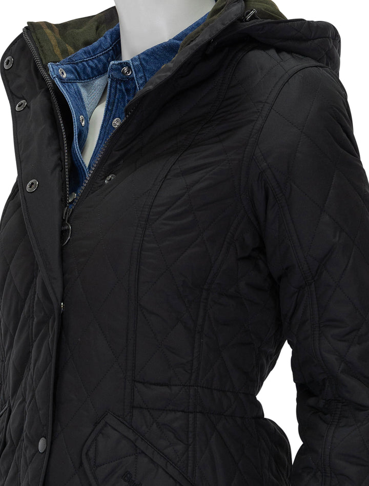 close up view of millfire quilted jacket in black