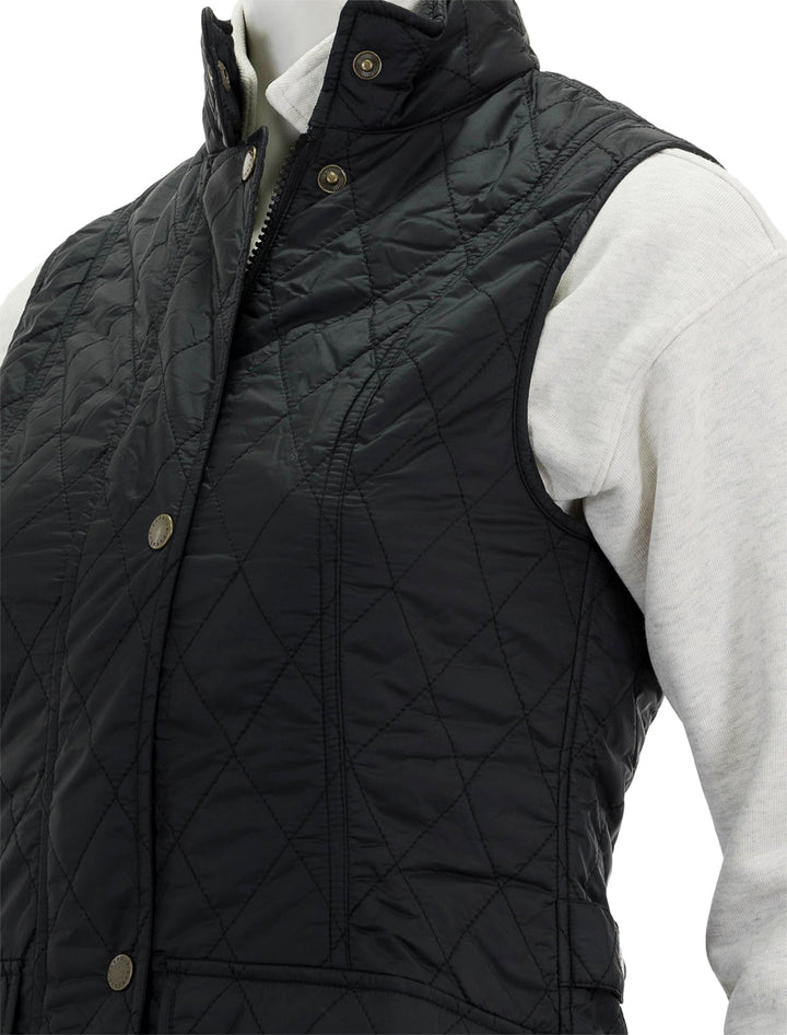 Close-up view of Barbour's otterburn gilet in black.