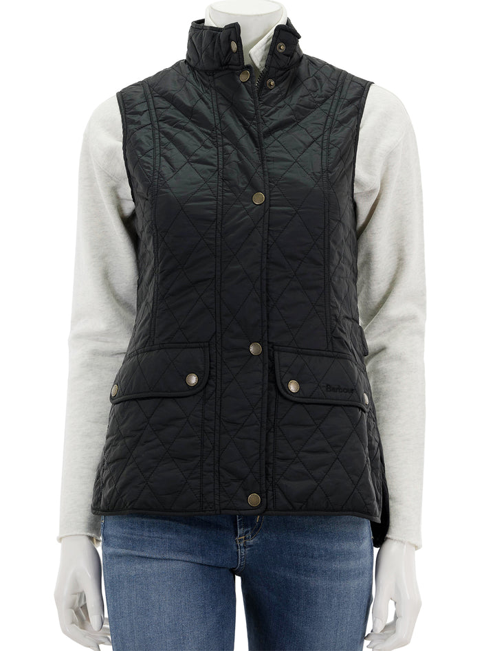 Front view of Barbour's otterburn gilet in black, zipped and buttoned.