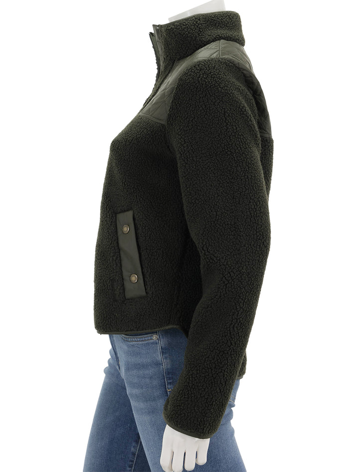 Side view of Barbour's rockling fleece in olive.