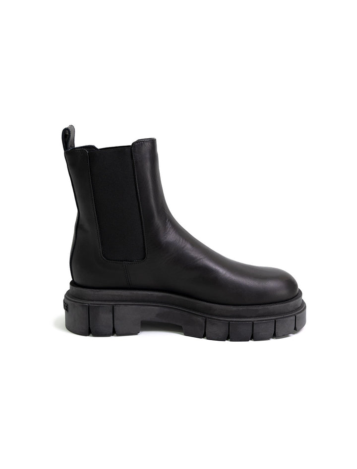 Side view of Mackage's storm chelsea boots in black.