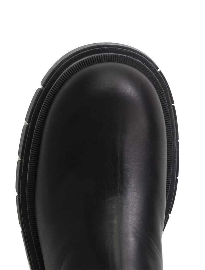 Close-up view of Mackage's storm chelsea boots in black.