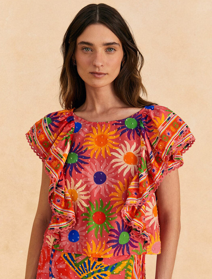 Model wearing Farm Rio's summer sun coral blouse.