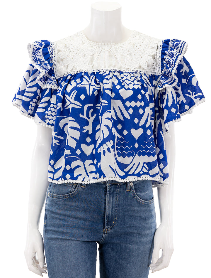 Front view of Farm Rio's jungles scarf blouse in navy blue.