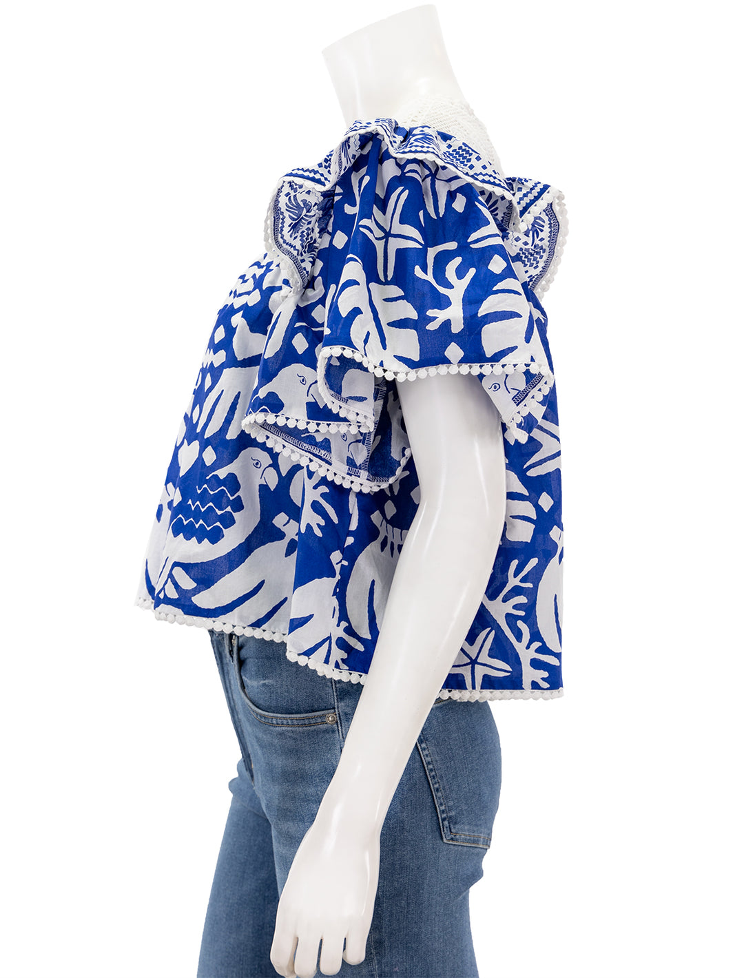 Side view of Farm Rio's jungles scarf blouse in navy blue.