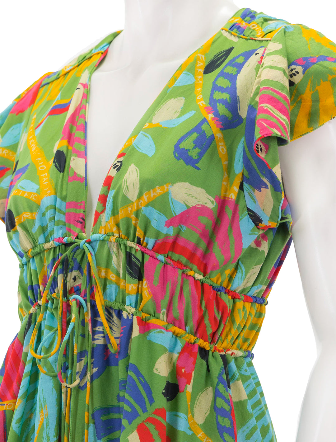 Close-up view of Farm Rio's forest birds midi dress in green.