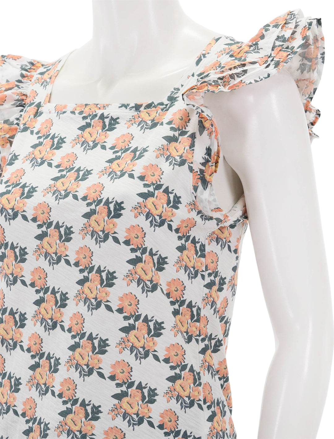 Close-up view of Nation LTD's cameo notched combo ruffle top in peach blossom.