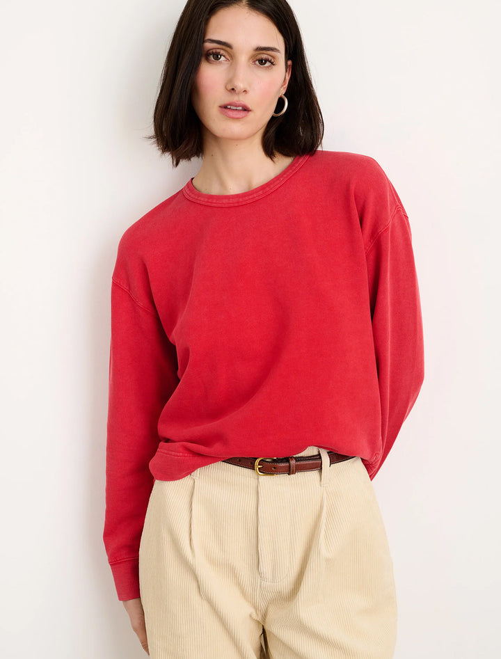 Model wearing Alex Mills' vintage sweatshirt you've been searching for in cardinal red.