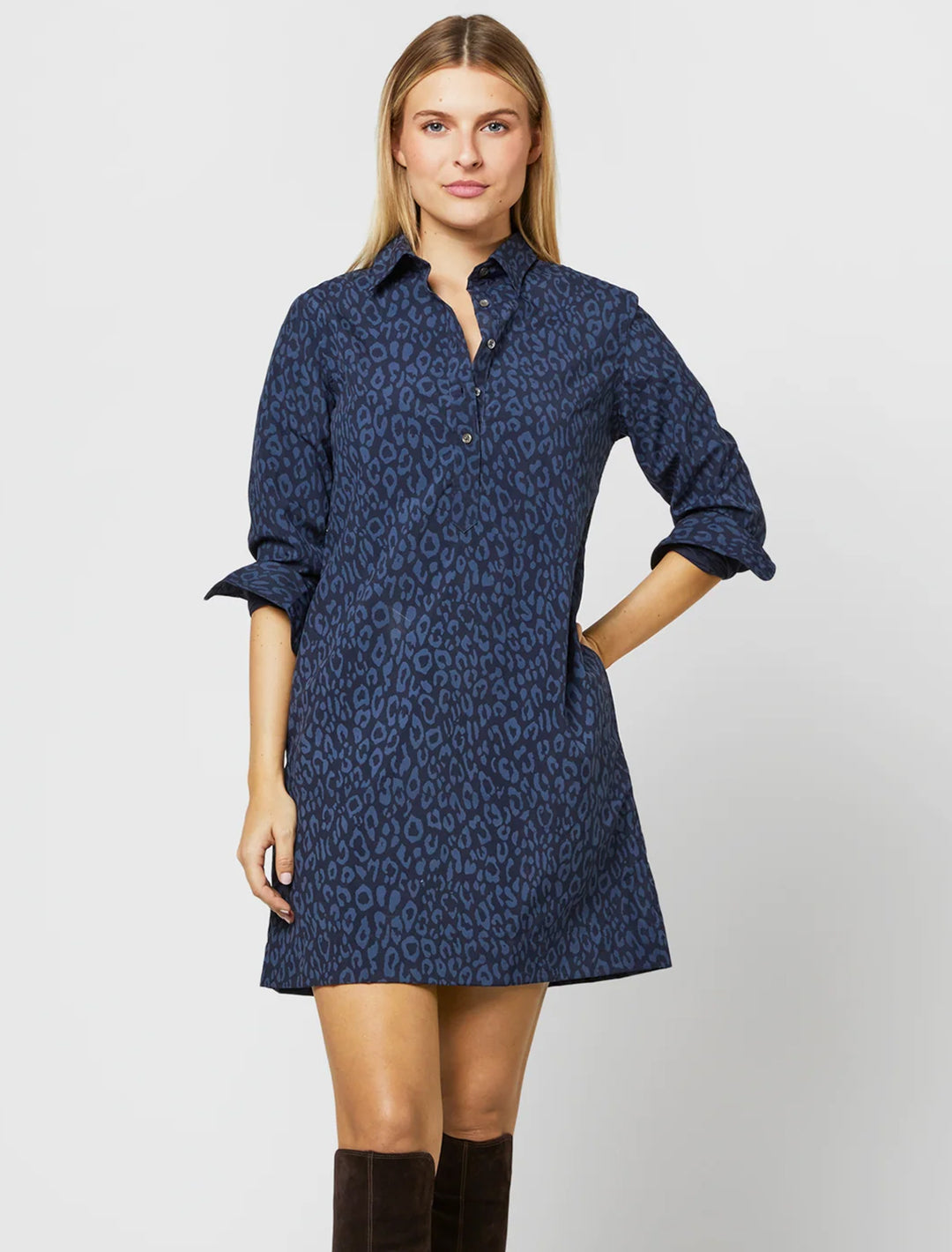 Model wearing Ann Mashburn's long sleeve popover dress in blue and navy leopard.