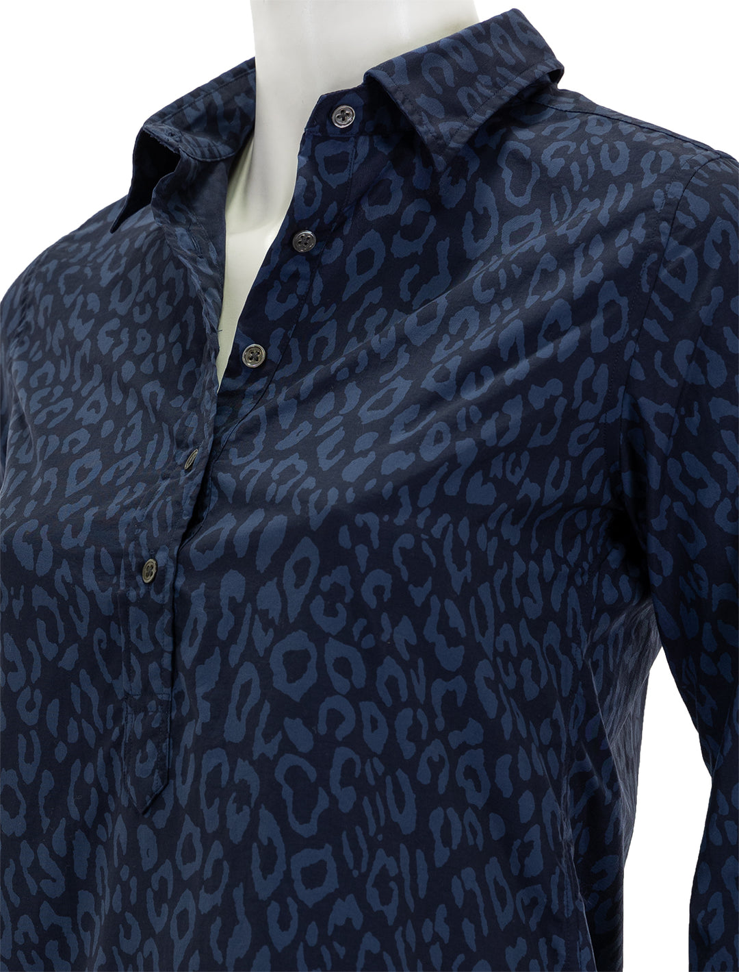 Close-up view of Ann Mashburn's long sleeve popover dress in blue and navy leopard.