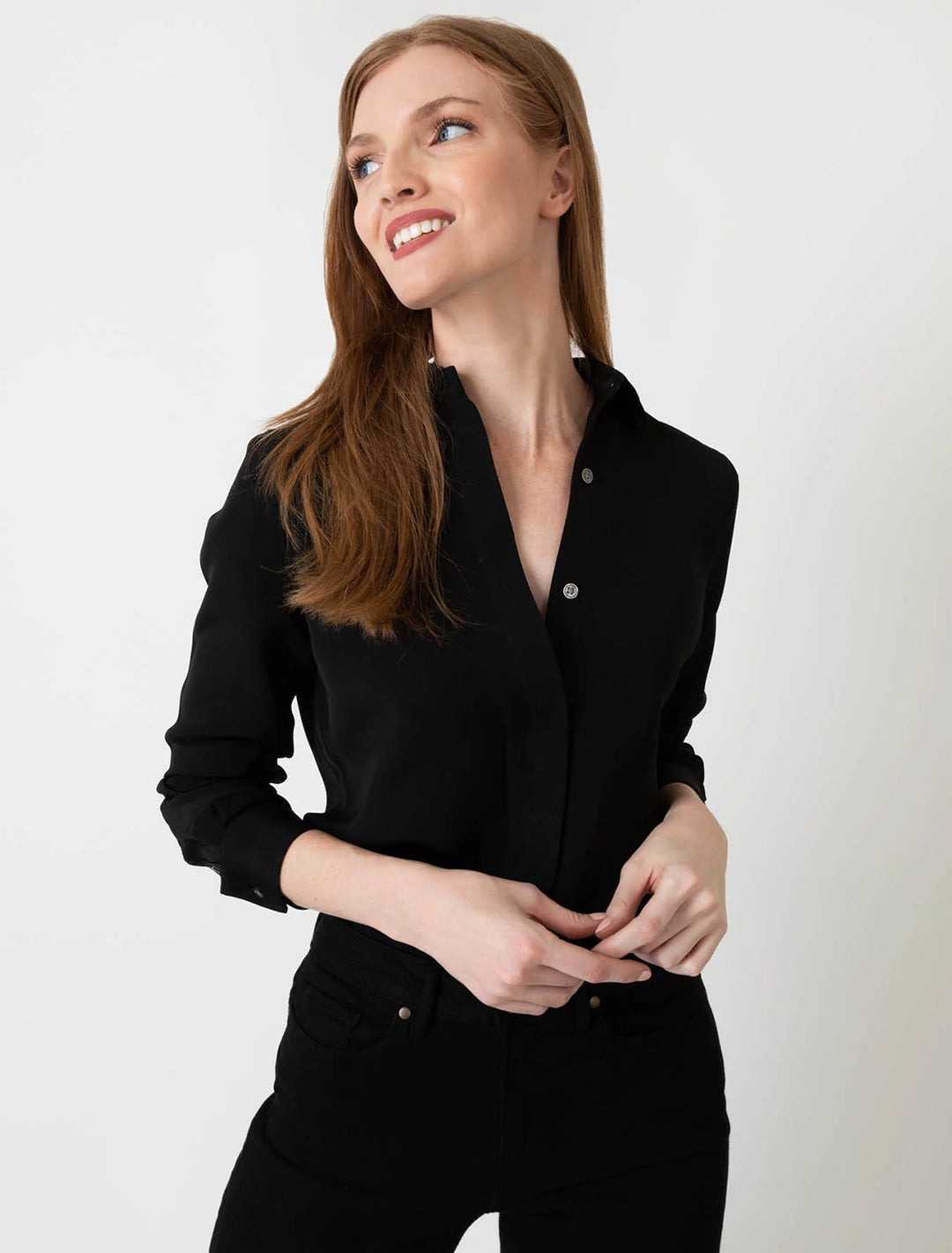 Model wearing Ann Mashburn's icon blouse in black.