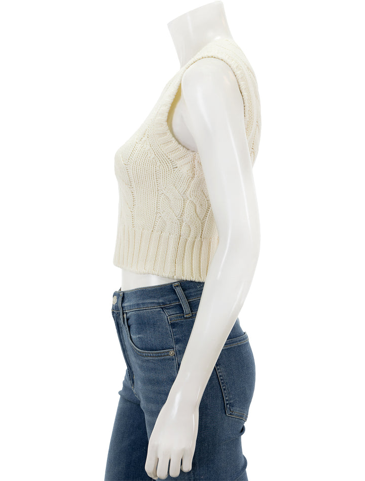 Side view of STAUD's pingo sweater vest in ivory.