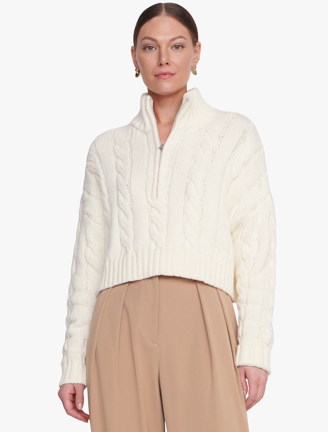 Model wearing STAUD's cropped hampton sweater in ivory.